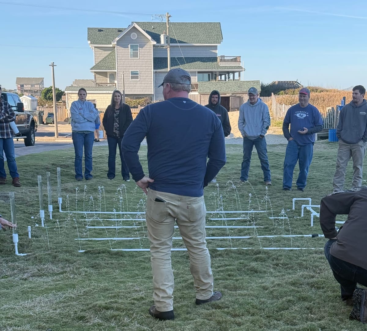 Instructor of Septic School showing how a Low Pressure Pipe System Works